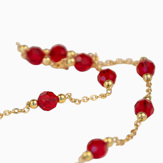 Bijoux Lafève en argent plaqué or avec perles de cristal rouge vif de la collection Facettes